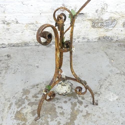 2601 - An antique painted wrought iron plant holder. Height 83cm.