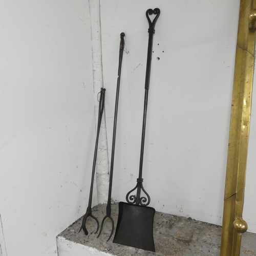 2611 - A set of wrought iron fire tools. Longest 120cm.