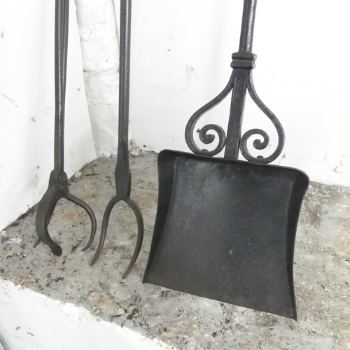 2611 - A set of wrought iron fire tools. Longest 120cm.