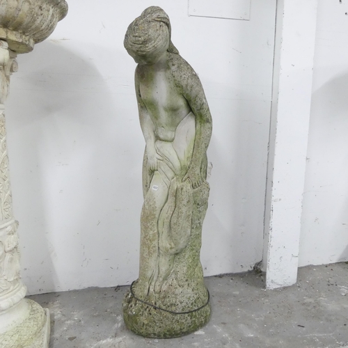 2615 - A weathered concrete garden statue, study of a classical lady. Height 79cm.