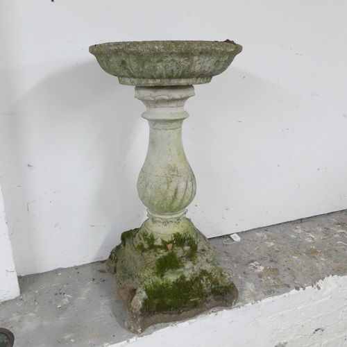 2618 - A two-section weathered concrete birdbath. Height 79cm.