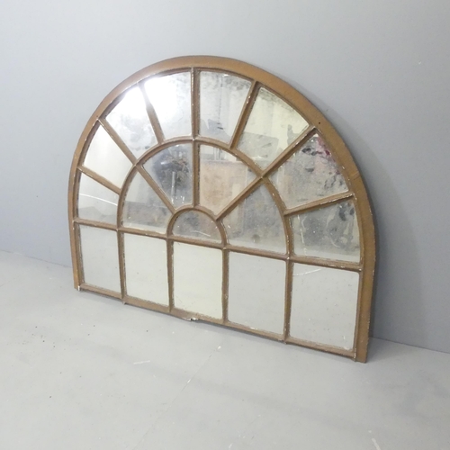 2620 - A Vintage arch top metal framed mirror 135x103cm.