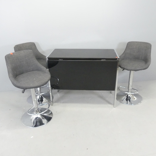 2625 - A glass drop-leaf table on chrome base, 94x76x48cm (opening to 90.5cm), and three Actona bar stools.