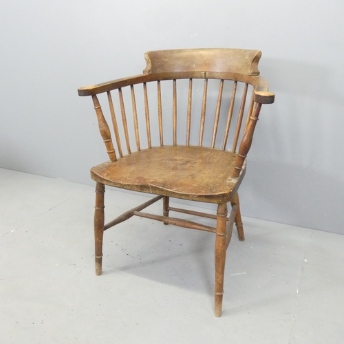 2639 - An elm seated smoker's bow arm desk chair.