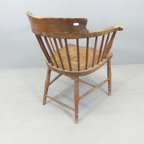 2639 - An elm seated smoker's bow arm desk chair.