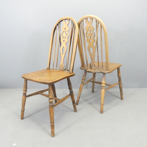 2640 - A set of four elm-seated wheel back dining chairs.