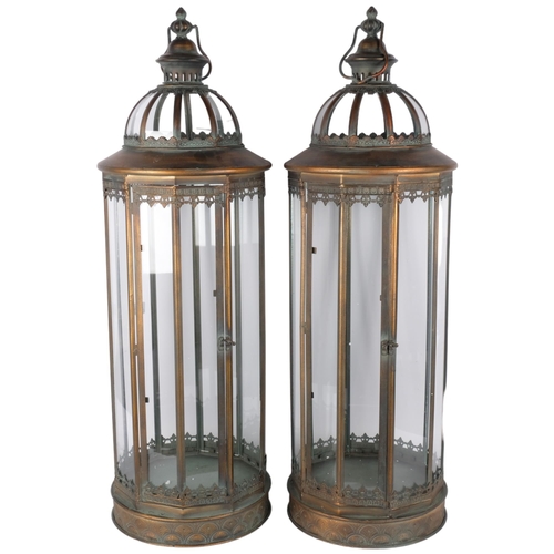 733 - A pair of large hanging copper lanterns, each with 10 glass panels, H85cm (2)