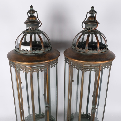 733 - A pair of large hanging copper lanterns, each with 10 glass panels, H85cm (2)