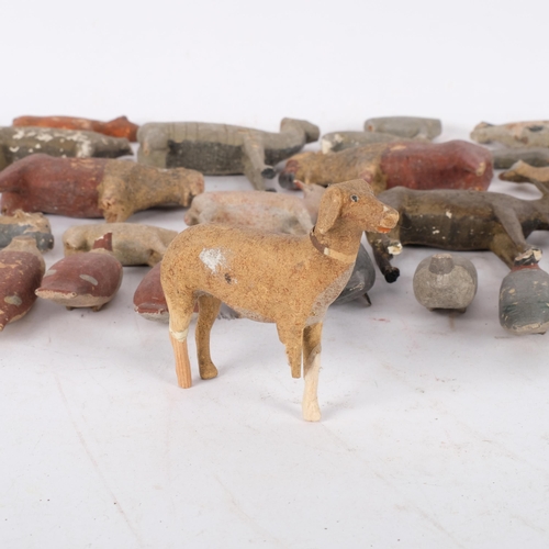 767 - A selection of handmade wooden animals and birds, both farmyard and woodland creatures