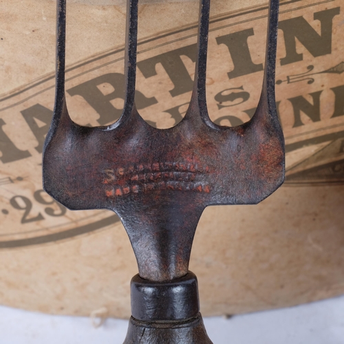 811 - A painted metal bottle holder, 29.5cm across, French cardboard hat box, a basket, and a garden hand ... 