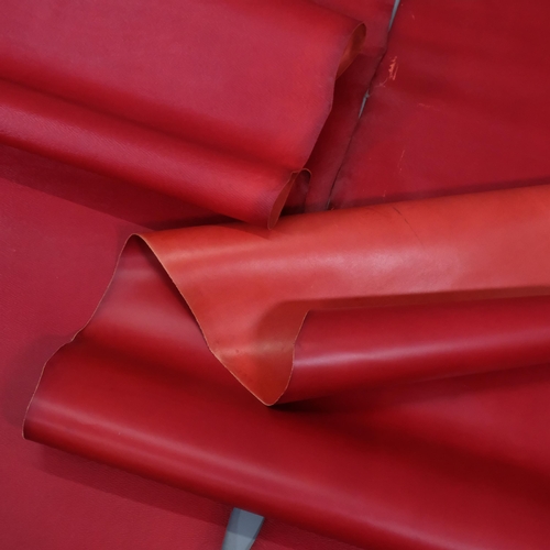 813 - 2 rolls of red bag hide leather, from J & E Sedgewick & Co, Walsall, width 136cm