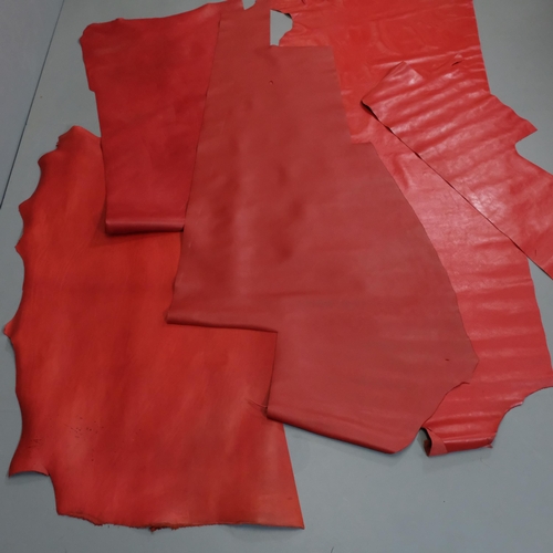 816 - 4 rolls of various red leather, widest 148cm