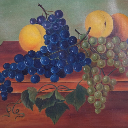 864 - An Antique oil on canvas still life painting, grapes and citrus fruits on a table, unsigned, in a wo... 