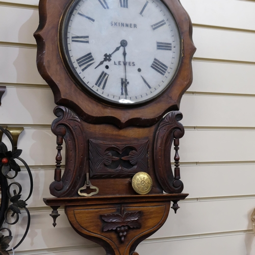 868 - An ornate mahogany drop-dial wall clock, clock face has narrative 