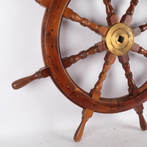 871 - A large reproduction ship's wheel, diameter 68cm