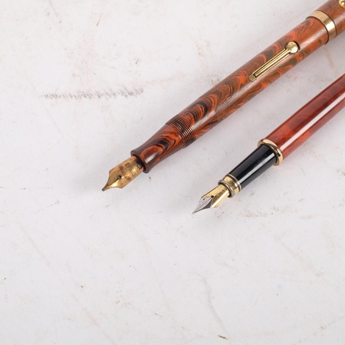 888 - A Watermans marble bodied fountain pen, with a 9ct gold band around the lid, nib is not gold, and a ... 