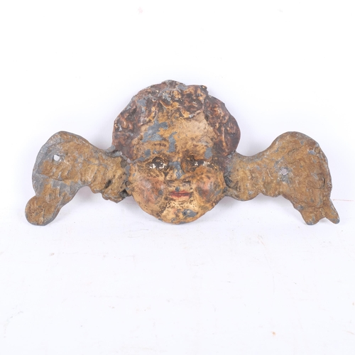 898 - An Antique lead putti, L20cm, quantity of paint present but is flaking