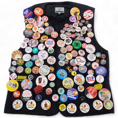 109 - A large collection of Vintage badges, mounted on a waistcoat, including the Beano, Dennis the Menace... 