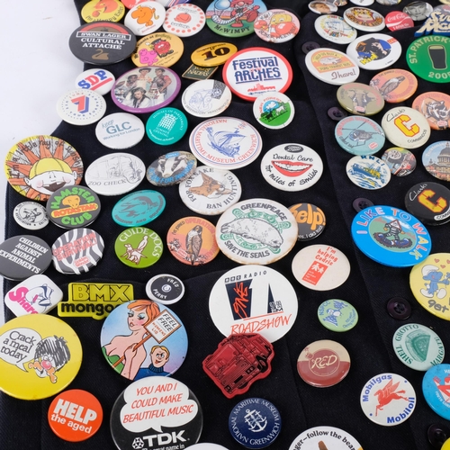 109 - A large collection of Vintage badges, mounted on a waistcoat, including the Beano, Dennis the Menace... 