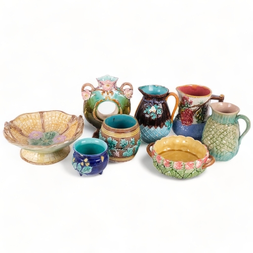 131 - A group of Victorian and later Majolica jugs, 2-handled basket, vase, etc (8)