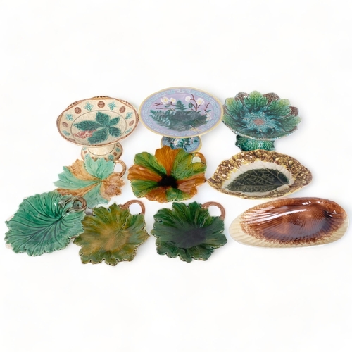 132 - A collection of Victorian Majolica leaf plates, shell bowl, and 3 comports (10)