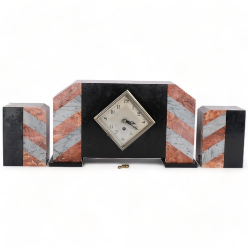 143 - A French Art Deco two-colour marble and slate-cased mantel clock garniture, replacement quartz mecha... 