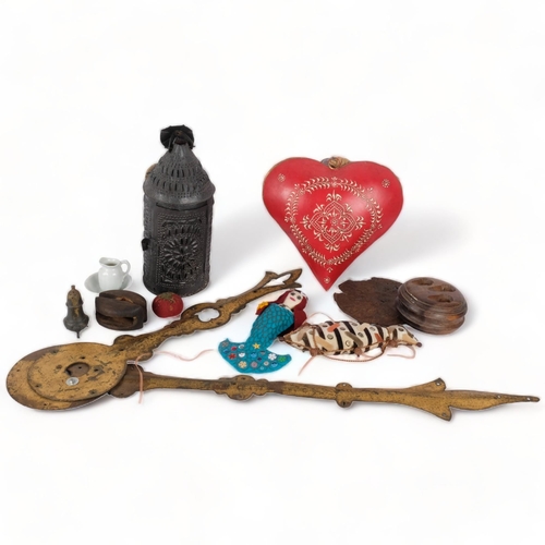 154 - A box of various items, including a painted metal heart, oversized clock hands, etc