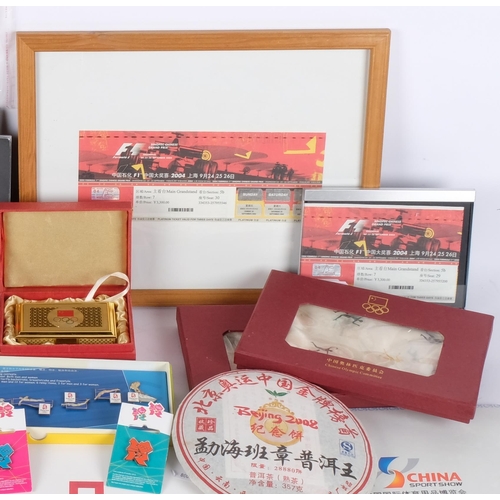 155 - A large quantity of Chinese Olympic commemorative wear, including the Olympic Games tea leaves, vari... 