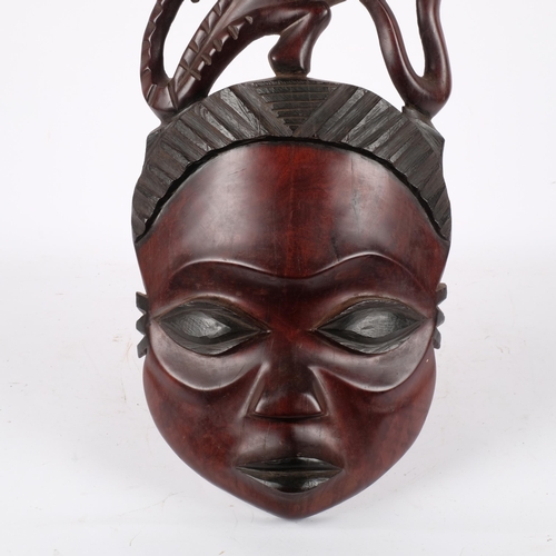 159 - An African carved hardwood figural panel, L110cm