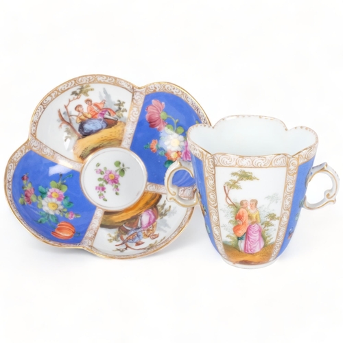 165 - An Antique Dresden quatrefoil 2-handled cup and saucer, painted blue and white panels decorated with... 