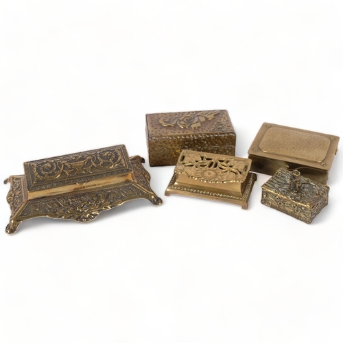 173 - A group of various embossed brass desk stamp boxes, a Vesta box surmounted by a mouse, an Art Nouvea... 