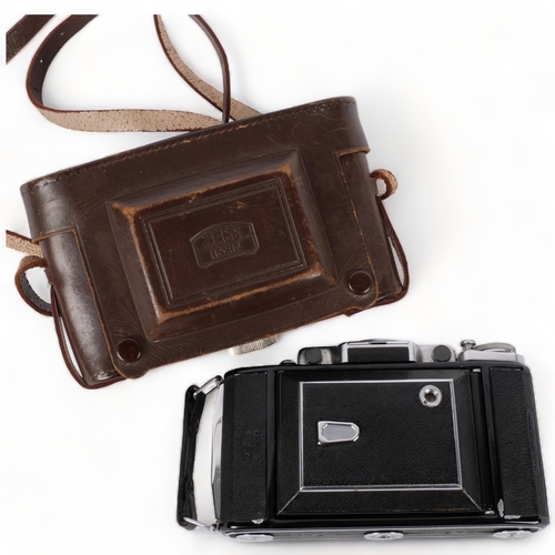 196 - A Vintage Zeiss Ikon folding camera, with a Zeiss opton no. 46096 Tessar 1--3,5 lens, and original c... 