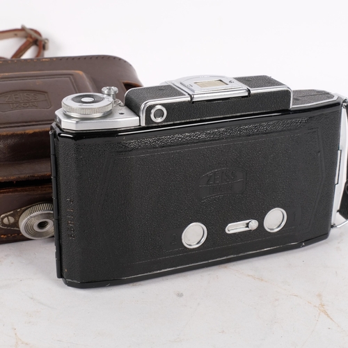 196 - A Vintage Zeiss Ikon folding camera, with a Zeiss opton no. 46096 Tessar 1--3,5 lens, and original c... 