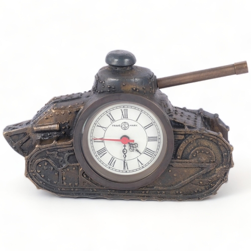 202 - An unusual embossed metal desktop clock, in the form of a tank, H10cm