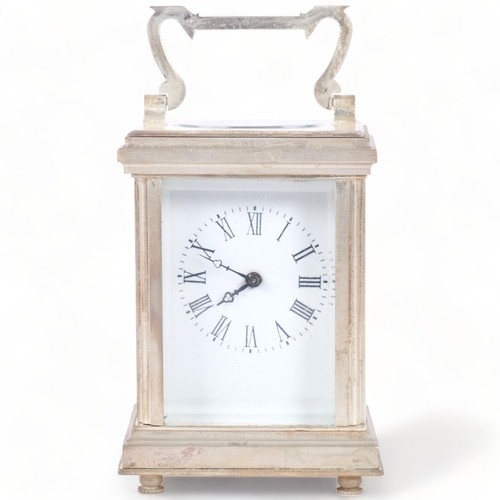 203 - A miniature silver plated carriage clock, with enamel dial, and key, height not including handle 8cm... 