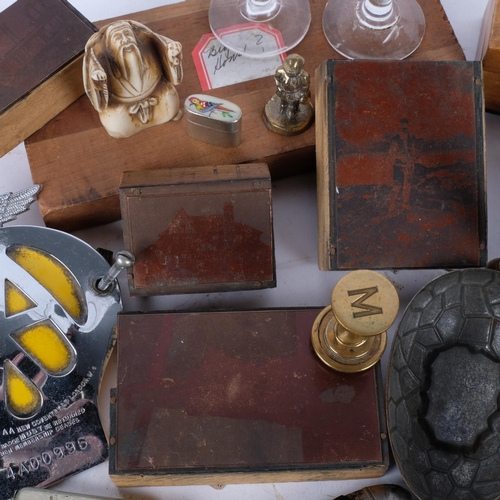 221 - A box of various items, to include an AA badge, Mauchline Ware box, printing blocks, penknife, Ronso... 