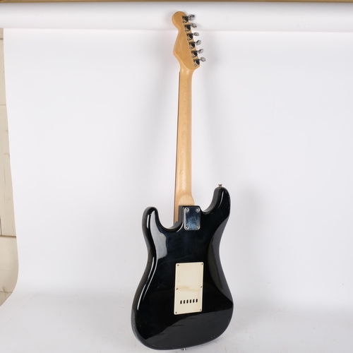 224 - A Squire Strat by Fender electric guitar, black body, no serial no.