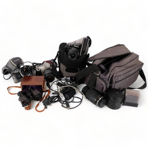 227 - A quantity of Vintage cameras and equipment, including an Olympus OM-1, an Olympus E400, a Canon EOS... 