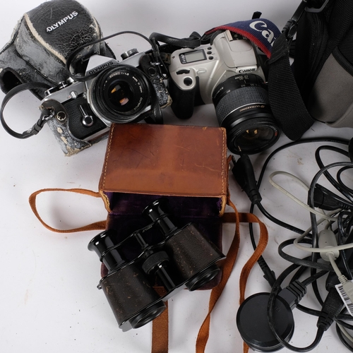 227 - A quantity of Vintage cameras and equipment, including an Olympus OM-1, an Olympus E400, a Canon EOS... 