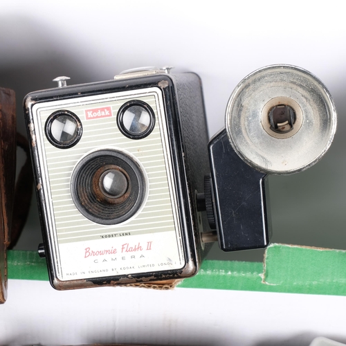 242 - A quantity of various Vintage cameras and associated accessories, including a Polaroid Joycam, a Top... 