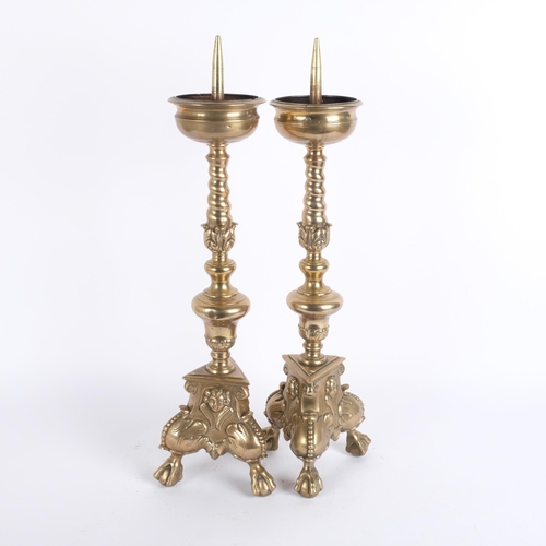 25 - A pair of Antique brass Flemish altar pricket candlesticks, overall height 58cm