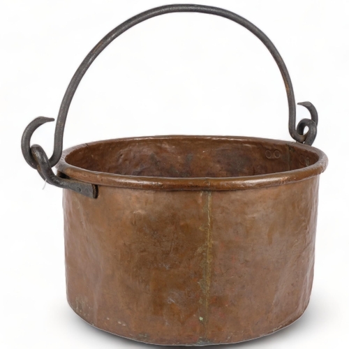 260 - A large Antique copper cauldron, with cast-iron hooks and handle, H28cm, D49cm