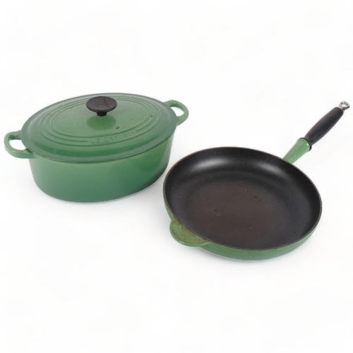 261 - LE CREUSET (FRANCE) - a green enamel cast-iron frying pan, and a Le Creuset 2-handled cooking pot, L... 