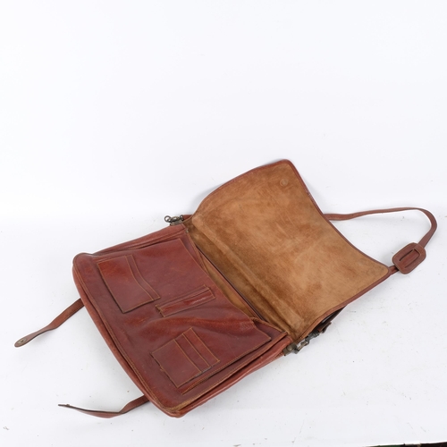 265 - A Vintage leather satchel, with 4 inside compartments, no identifiable maker's label