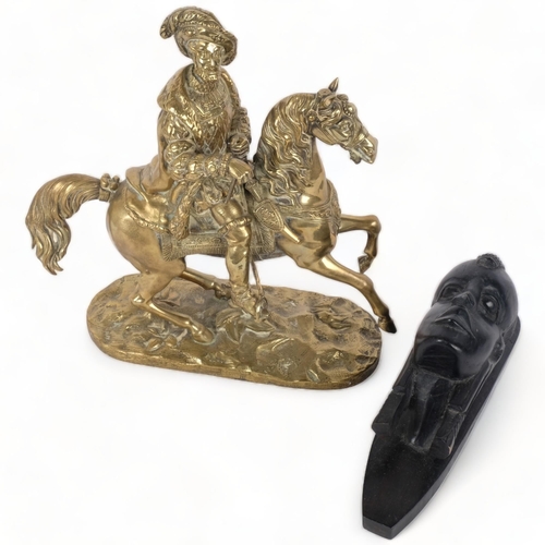 279 - A cast-brass Cavalier on horseback, 27cm, and an African ebony wall mask