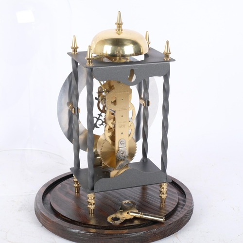 281 - A brass skeleton clock, under glass dome on plinth, height overall 31cm