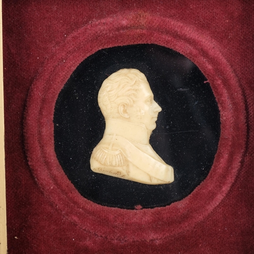 284 - A 19th century wax relief portrait of a gentleman, framed, H18.5cm overall, and a cast-bronze modern... 