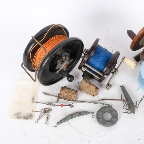 285 - An Alcock fishing reel, a Penn reel, etc