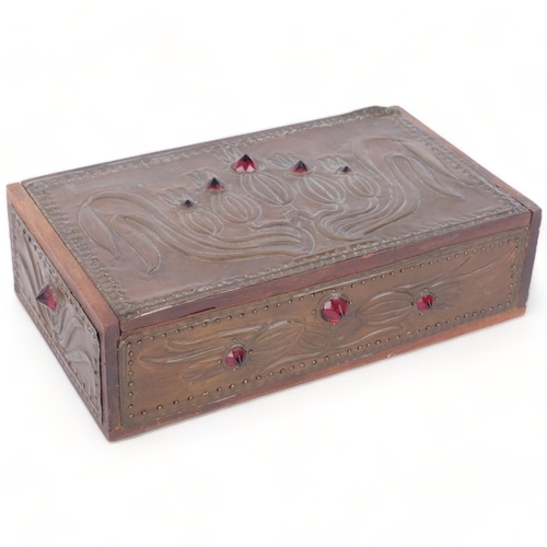 286 - An Art Nouveau copper-clad box, with inset red stones (A/F), 21.5cm across