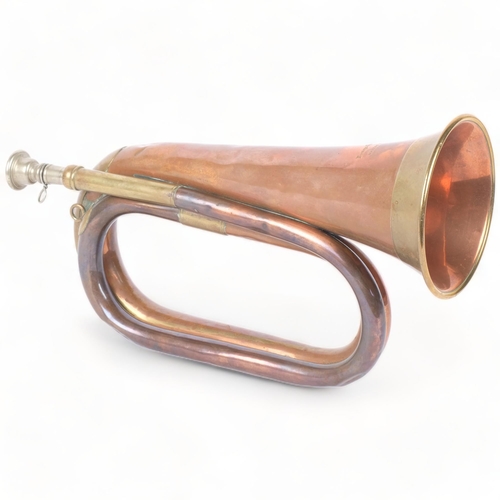 287 - A Boosey & Hawkes brass and copper bugle, L29cm